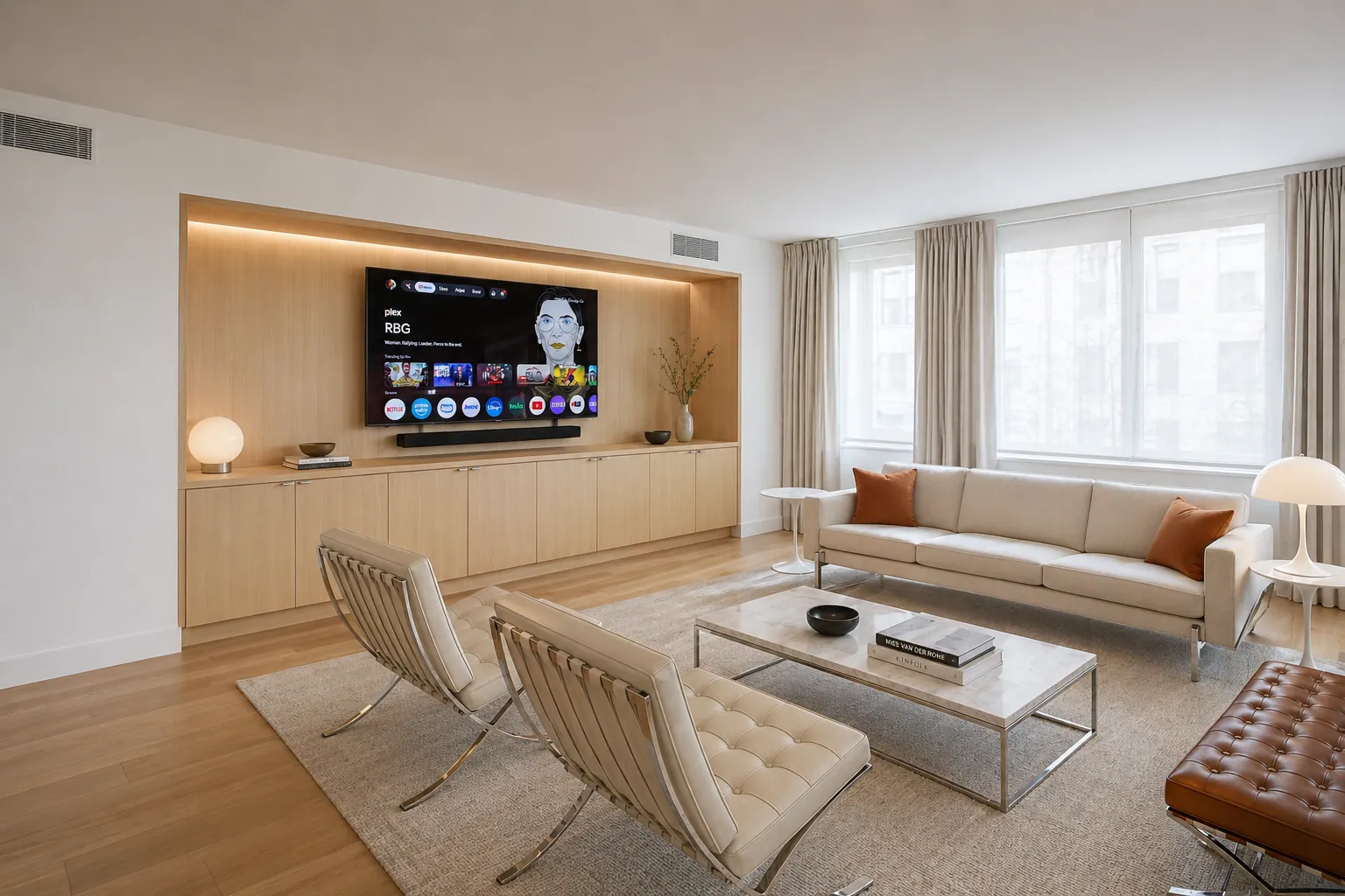 A refined NYC living room with a custom oak built-in media wall and designer furnishings