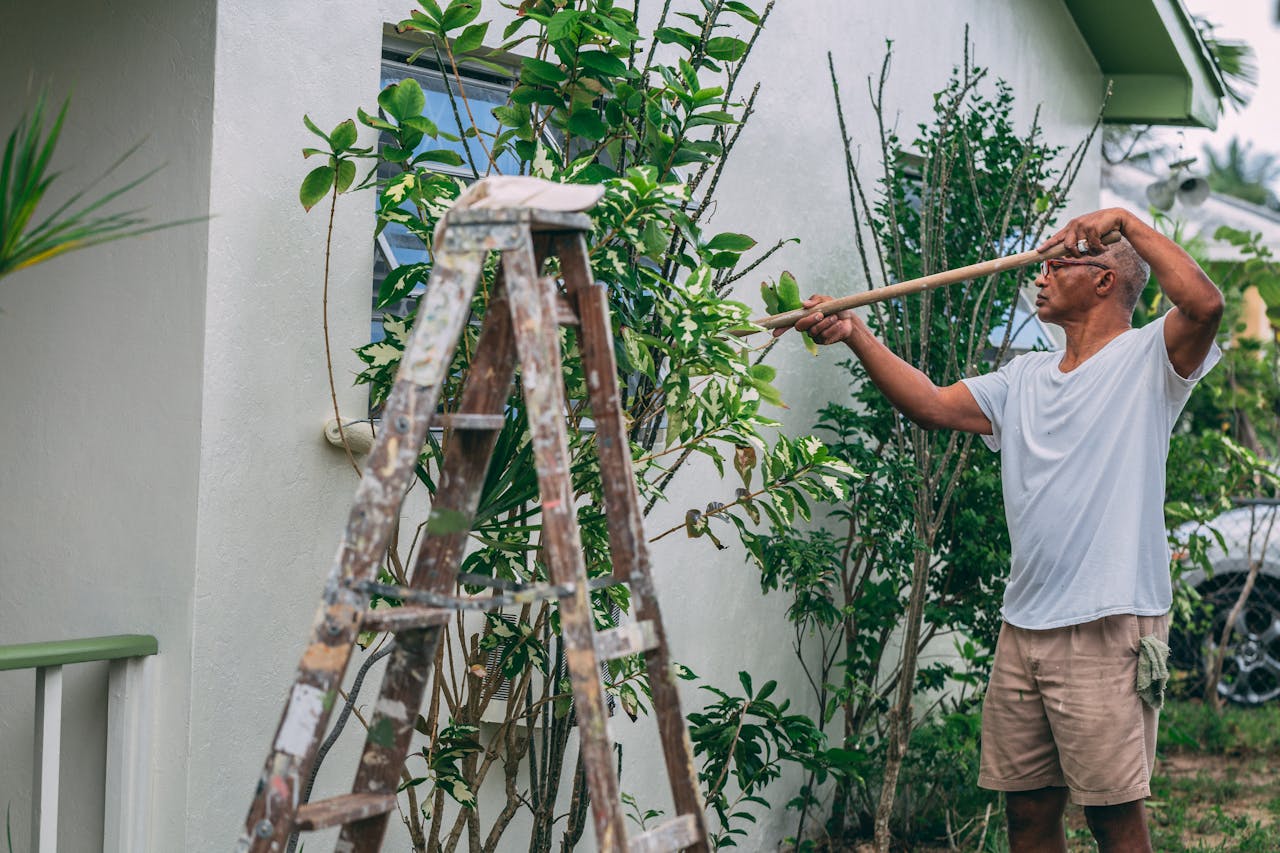 A man painting a house