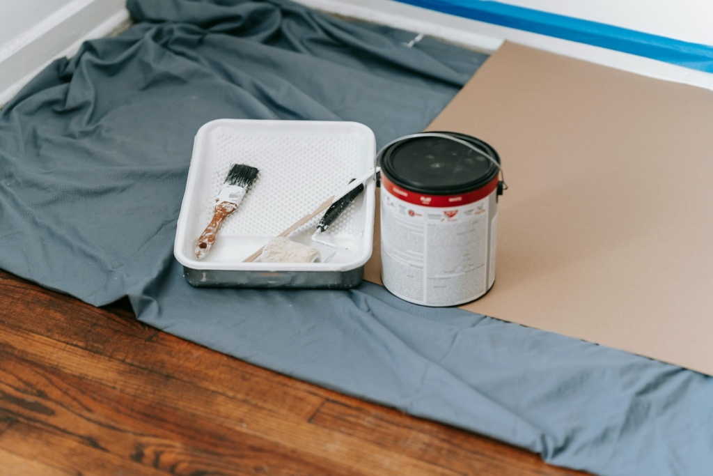 painting materials on the floor.